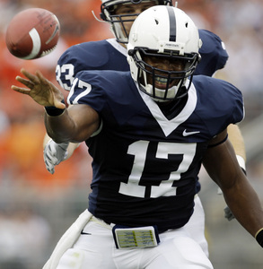 Penn State quarterback Daryll Clark tosses the ball to an official as he celebrates after running for a first down against Oregon State.