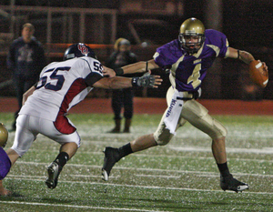 Roman Catholic quarterback Joseph Fuoco (right) is chased by Cardinal O'Hara's Chris Nolan in last week's 21-14 loss. Fuoco will try to rebound against Father Judge tomorrow.