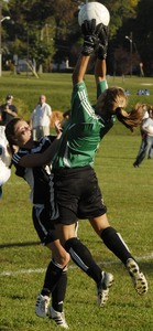Gateway's Peggy Nicole leaps to snare a shot over Haddonfield's Kathleen Jordan.