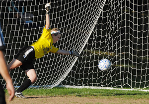 Springfield (Delco) goalkeeper Danielle Gronlie dives but can't stop a goal by Octorara, which won the nonleague soccer contest, 5-2. Erin Donnelly scored twice in the Braves' victory.