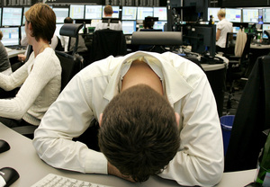 A broker at the stock market in Frankfurt, Germany, yesterday. Fear has gripped investors worldwide, despite radical actions.