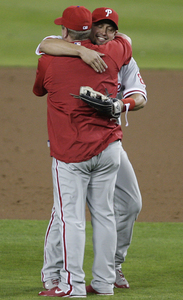 Shane Victorino hugs Matt Stairs after game ends.