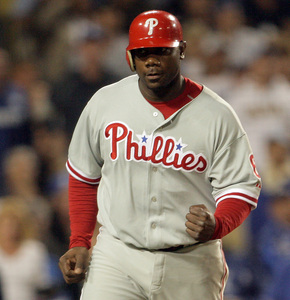 Ryan Howard pumps his fist after scoring tying run on a wild pitch in the sixth inning.