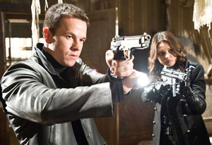 Mark Wahlberg and Mila Kunis aim for serious results in a scene from "Max Payne," opening Friday. The revenge saga is based on a video game.
