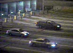 Police released this security-camera image of the gray Ford pickup (top) as it left the toll plaza at the Walt Whitman Bridge on Oct. 5. They want to speak to the driver.