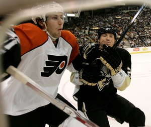 Braydon Coburn and Pittsburgh's Ruslan Fedotenko battle along the boards.
