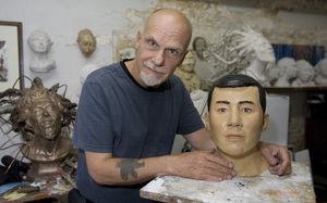 Sculptor Frank Bender, with bust he created based on remains of unidentified victim, an Asian male.