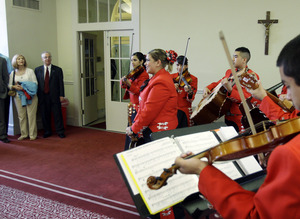 Steve (second from left) and Caroline Lake (left) are serenaded at Our Lady of the Lake University - their 500th college visit.