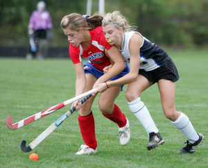 A battle for the ball between Casey Haegele of Central Bucks South and Neshaminy's Kristien Dougherty (left).