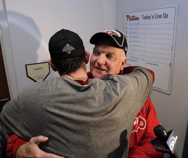 Charlie Manuel, right, hugs Brad Lidge outside the clubhouse after the Phillies defeated the Tampa Bay Rays to win the World Series  at Citizens Bank Park in Philadelphia, Pa., October 29, 2008. ( David Maialetti / Staff Photographer )