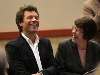 Singer Jon Bon Jovi shares a laugh with Sister Mary Scullion, executive director of Project HOME, during a Friday ceremony to establish a $3 million program to help homeless veteranss in Philadelphia.
