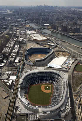 The new Yankee Stadium, with the old one in the background.
