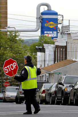 Crossing guard Thelma Van Horn works outside Linwood Elementary School next to the Sunoco Marcus Hook refinery.