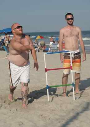 At the beach in Ventnor, next to one of two "ladders," Jon Broyles (left) makes a toss. Friend Matt Henneke observes.