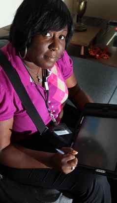 Delores Brokenborough, an inspection supervisor with the city health department, uses a digital tablet for inspections.