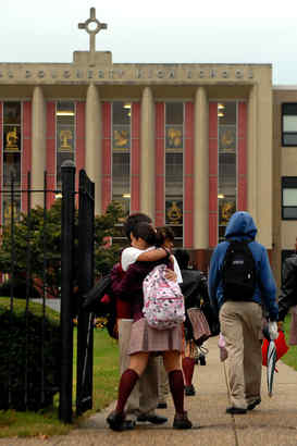 Students arrive at Cardinal Dougherty High School. It and Northeast Catholic High School for Boys, both declining in the city, will close in June. But a new high school is being built near Royersford.