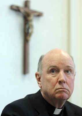 Wilmington Bishop W. Francis Malooly , at a news conference yesterday. On the eve of eight sex-abuse trials, the diocese filed for bankruptcy protection. A moratorium on the statute of limitations had resulted in 142 lawsuits.