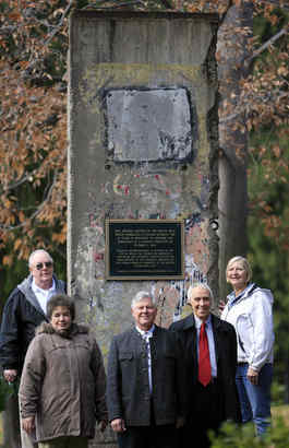 At a German club in Warminster, local German Americans (from left) William and Carol Ebinger, William Aust, Louis Oschmann, and Verna McDermott with the wall segment, which arrived in Philadelphia in 1990.