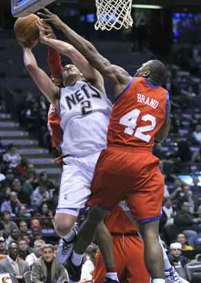 "Of course, I&acute;m a realist, I understand. You sign a big contract, you expect big numbers," the Sixers&acute; Elton Brand, defending against the Nets&acute; Josh Boone, says of his subpar production.