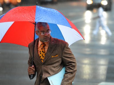 Damon K. Roberts ran through the rain at 15th and Market Streets on Thursday. A drought watch, called for Philadelphia and much of the rest of the state after the summer&rsquo;s dry start and before August&rsquo;s drenching rains, remains in effect. (Clem Murray / Staff Photographer)