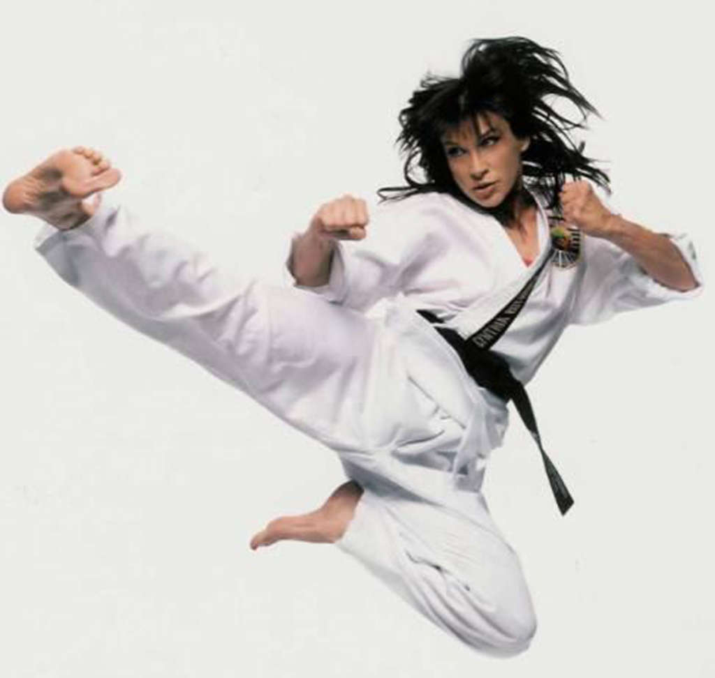female martial artists flying kick