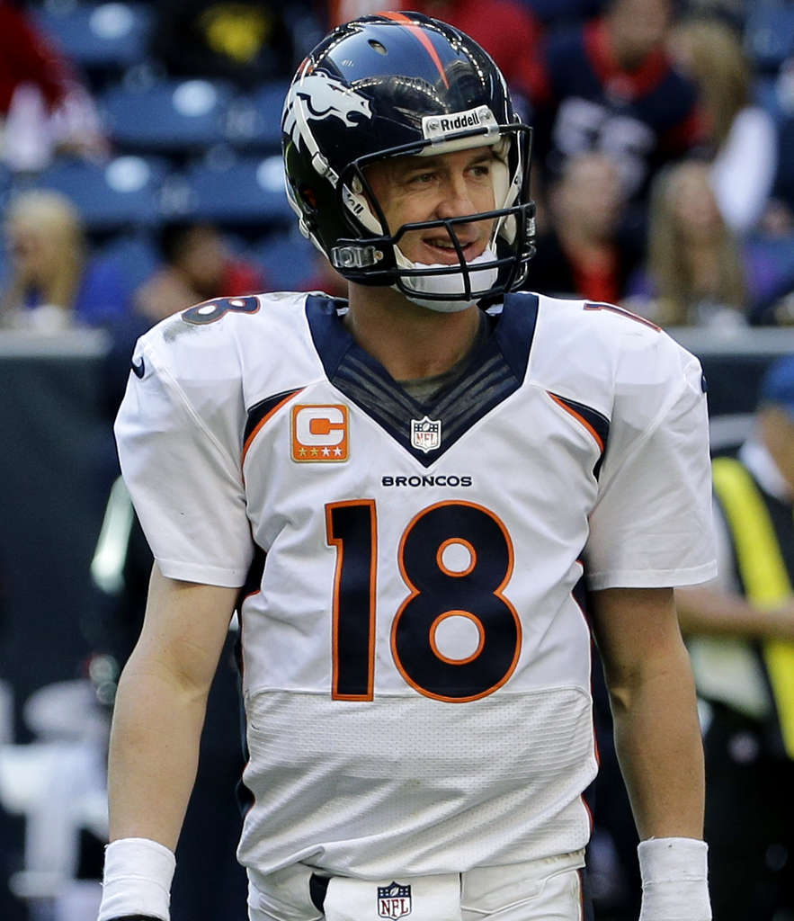 Rockies' Todd Helton watches ex-teammate Peyton Manning on Broncos