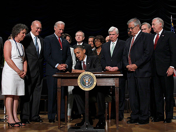 President Obama signs Dodd-Frank in 2010. PABLO MARTINEZ MONSIVAIS / Associated Press
