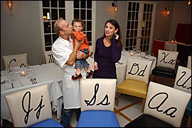 Chef/owner Jayson Grossberg with daughter Skylar, 11/2, and wife Alix, amid a sea of letters at Alphabet Soup in Audubon, Camden County. Grossberg has had jobs with Bobby Flay and Union Square Cafe. LINDA JOHNSON / Inquirer