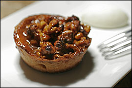 A standout dessert: A pastry cup filled with walnuts tossed in caramel. ERIC MENCHER/Inquirer