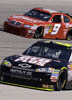 NASCAR drivers Jeff Gordon (24) and Kasey Kahne (9) drive through turn four during practice for Sunday&acute;s NASCAR Sprint Cup Series Samsung 500 auto race at Texas Motor Speedway, Saturday, April 4, 2009, in Fort Worth, Texas. (AP Photo/Larry Papke)