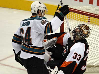 San Jose Sharks&acute; Jamie McGinn celebrates teammate Jed Ortmeyer&acute;s third period goal past Flyers&acute; goalie Brian Boucher.  (Yong Kim / Staff Photographer)