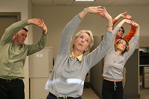 Tai chi classes are among the offerings available to Sue Elliot (center) and other employees at Charon Planning Corp., a health and welfare benefits consulting and brokerage firm in Warrington.