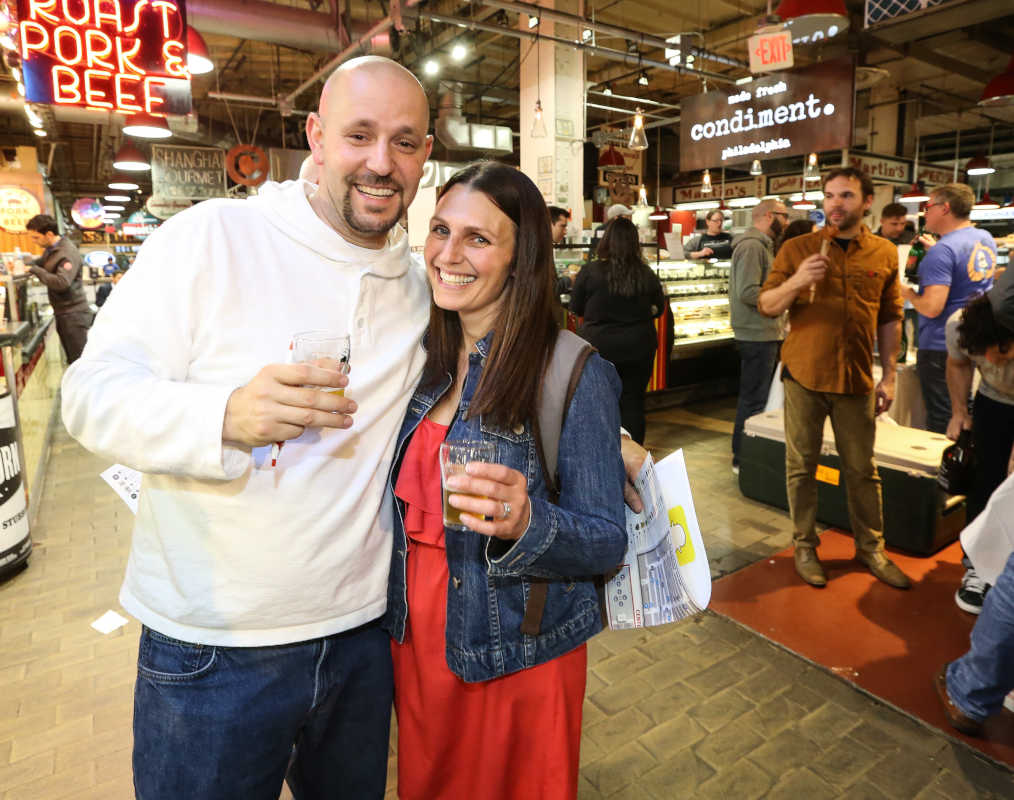 Jerrett and Amanda Muzi from Ardmore enjoying Brewvitational at the Reading Terminal Market, Thursday, May 11, 2017.  