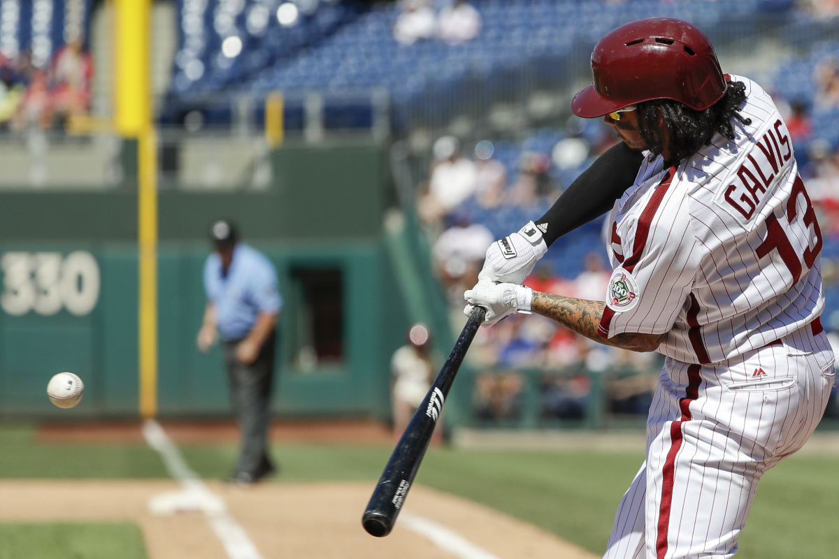 Phillies&acute; Freddy Galvis hits a seventh-inning solo home run, his second of the game, against the Padres on Sunday.
