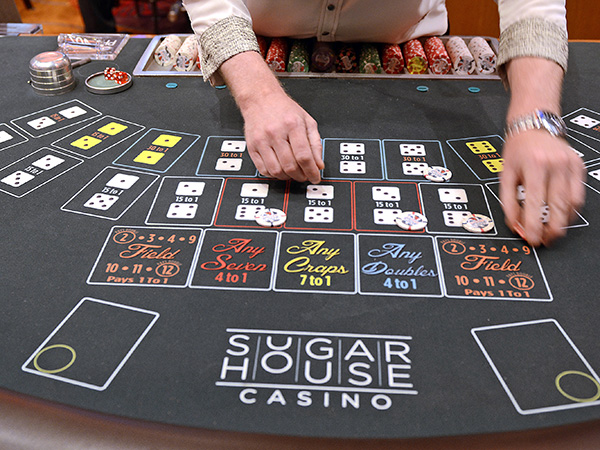A casino delaer at work. (TOM GRALISH / Staff Photographer / File )
