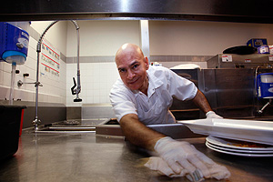 Roberto Placencia, a dishwasher at the Crowne Plaza Valley Forge in King of Prussia, where employees say they are encouraged to solve problems creatively. (Laurence Kesterson / Staff Photographer)