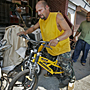 Jose takes his bright yellow Hummer BMX bike out for a quick spin after fixing a puncture to the rear tire. ALEJANDRO A. ALVAREZ / PHILADELPHIA DAILY NEWS