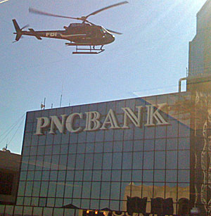 No, there wasn´t an airborne helicopter duel on Market Street today, even though it looked that way. A pair of choppers, with stunt people standing on their rails, appeared to attack an office building, but it was all for the benefit of a movie crew filming atop the PNC Bank building.