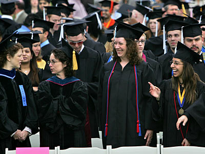 There were a lot of smiles among these graduates from the University of Missouri-Kansas City. Already-high student loan rates are expected to go up even more because of the bad economy. (Jennifer Hack/Kansas City Star/FILE)