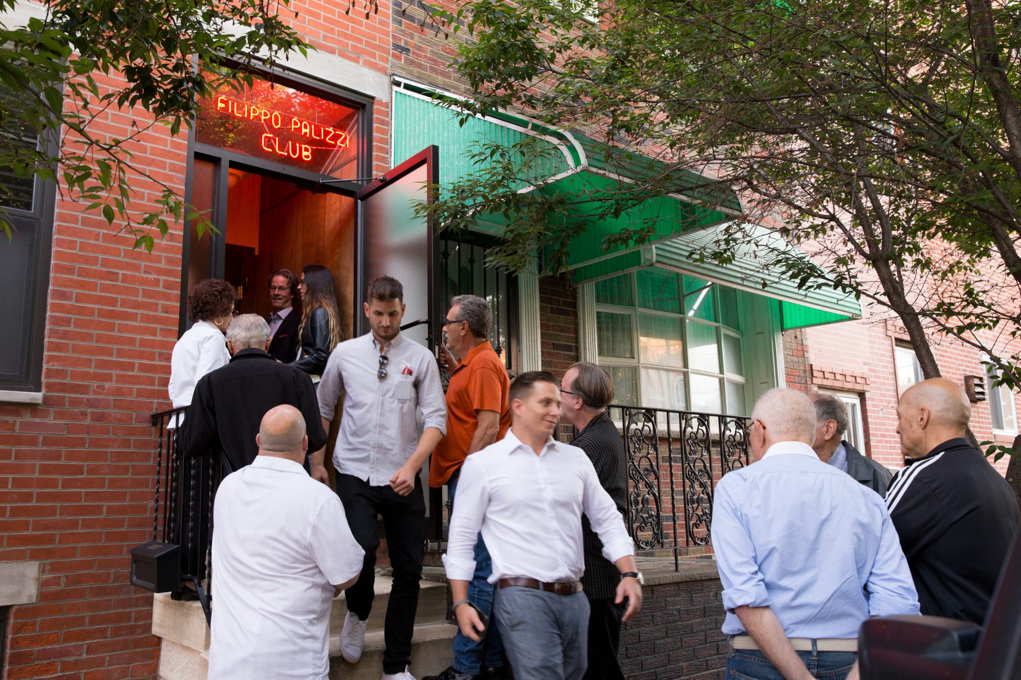 Patrons at the entrance of the Palizzi Social Club, JESSICA GRIFFIN / Staff Photographer
