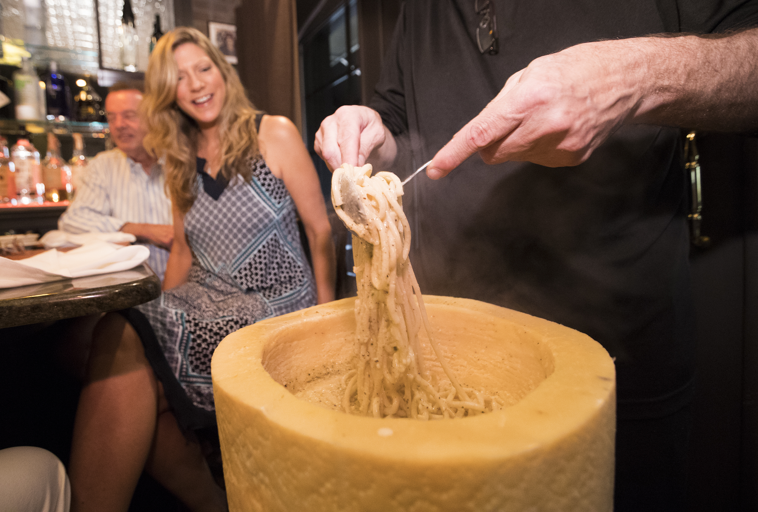 Freshly prepared pasta is gently tossed into a wheel of Pecorino to make cacio e pepe at Cafe 2825 in Atlantic City. 