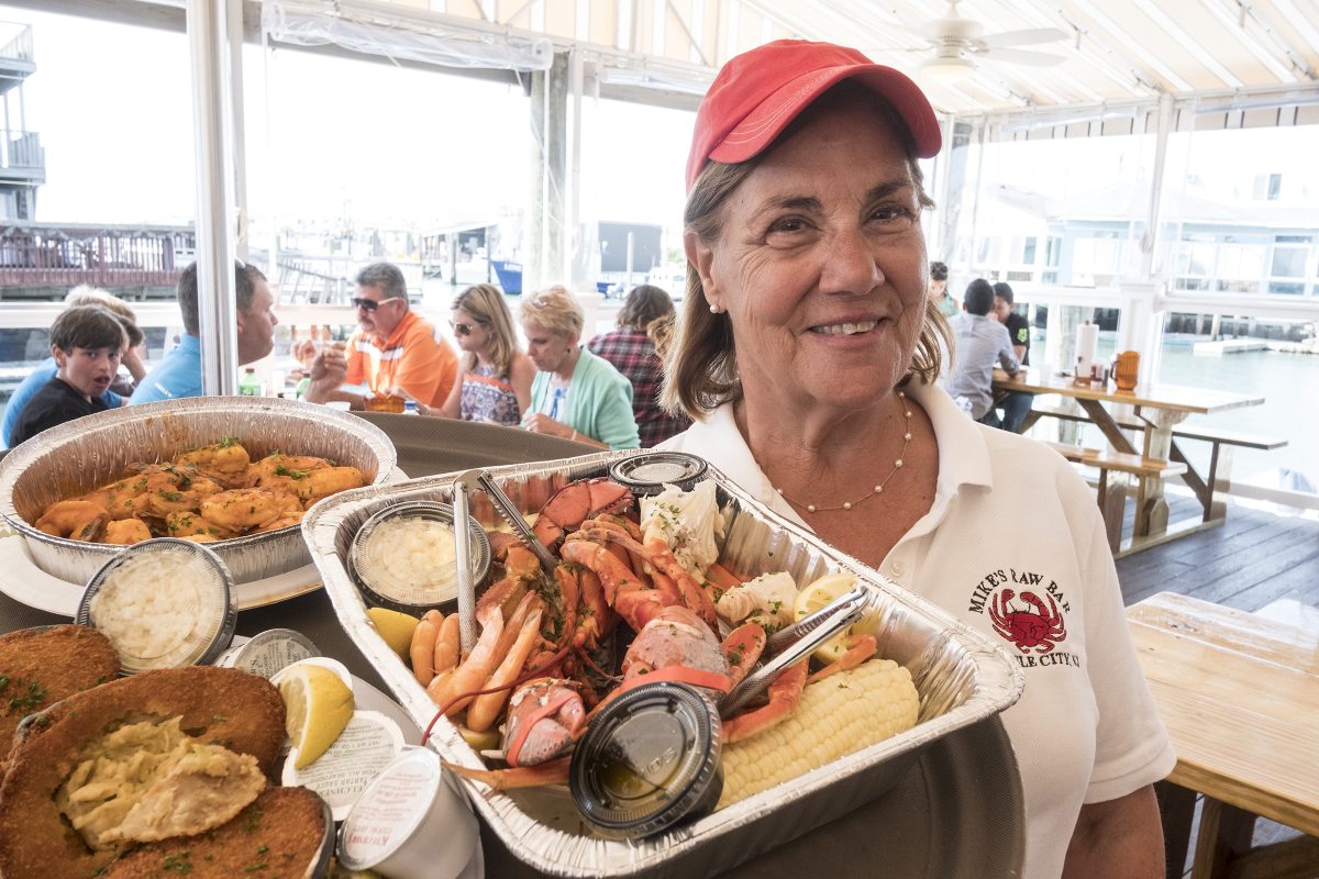 Rosemary Deery with an order of seafood at Mikes Seafood and market in Sea Isle City. ED HILLE / Staff Photographer 