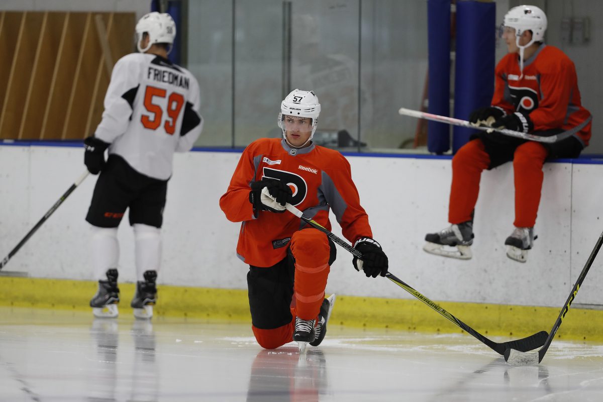 The Flyers’ Travis Sanheim stretches during development camp Saturday. 