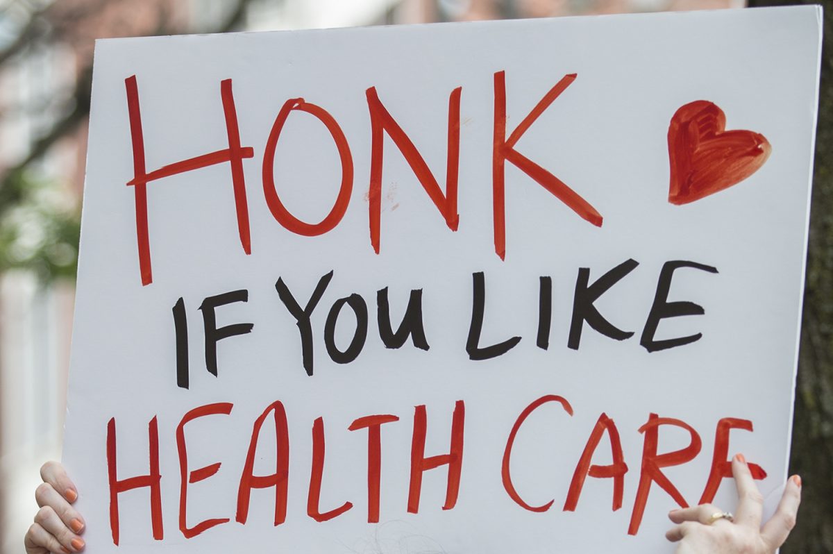 A protester’s sign outside the Philadelphia office of Sen. Pat Toomey (R., Pa.) last month. The health-care bill that Toomey helped craft would hit Pennsylvania hard. In some ways, it could be even worse in New Jersey.   MICHAEL BRYANT / Staff Photographer 