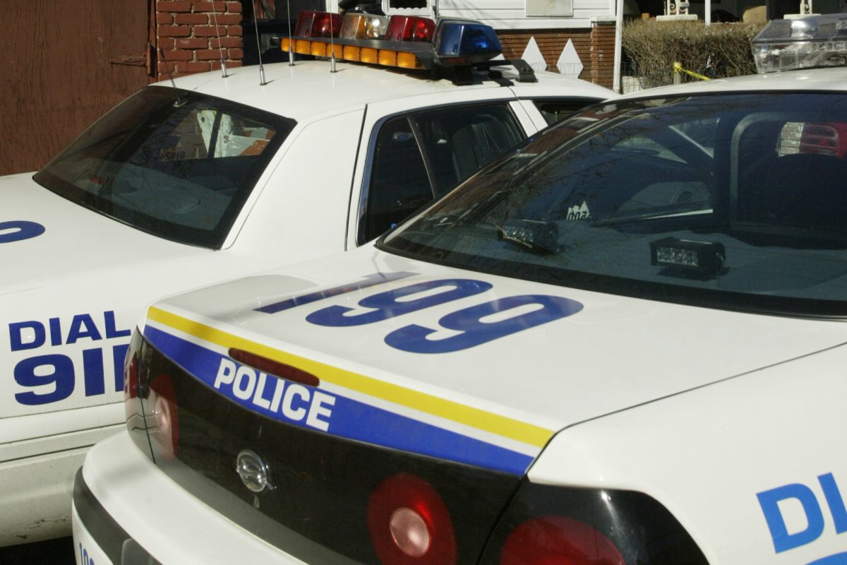 Police cars outside a crime scene. 