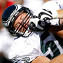 L.J. Smith, right, grabs Rocky Boiman&acute;s face mask during a blocking drill at  Eagles Training Camp at Lehigh University in Bethlehem, Pa., on August 4, 2008. <br />David Maialetti / Philadelphia Daily News<br />