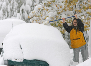 Montana got an early blast of winter. On Sunday, Sam Shangeaux of Billings had to use a broom to clear her car. 