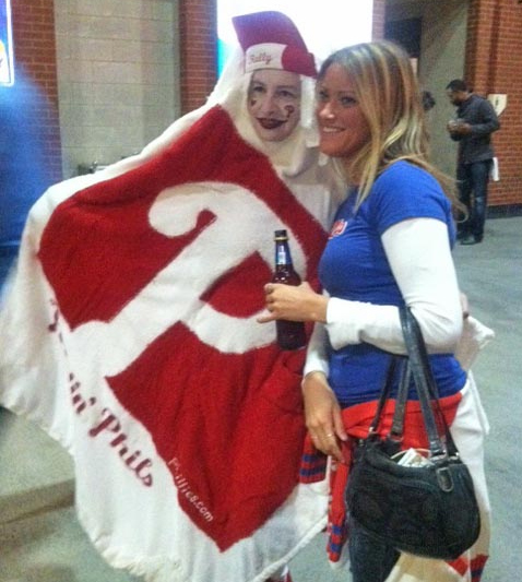 Woman covers face with lipstick at Phillies game