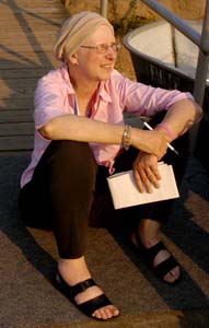 Weakened by the disease, Fawn Vrazo sits on the dock, notepad in hand, as the dragon boat Hope Afloat, whose crew consists of breast- cancer survivors, paddled on the Schuylkill during the summer of 2005.<br /><br /><br /><br />