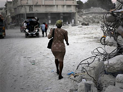 A woman walks through a destroyed area in Port-au-Prince, Tuesday, Feb. 9, 2010. A powerful earthquake hit Haiti on Jan. 12. (AP Photo/Ramon Espinosa)